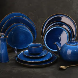 Deep blue tableware with tonal surface variation - styled table scene