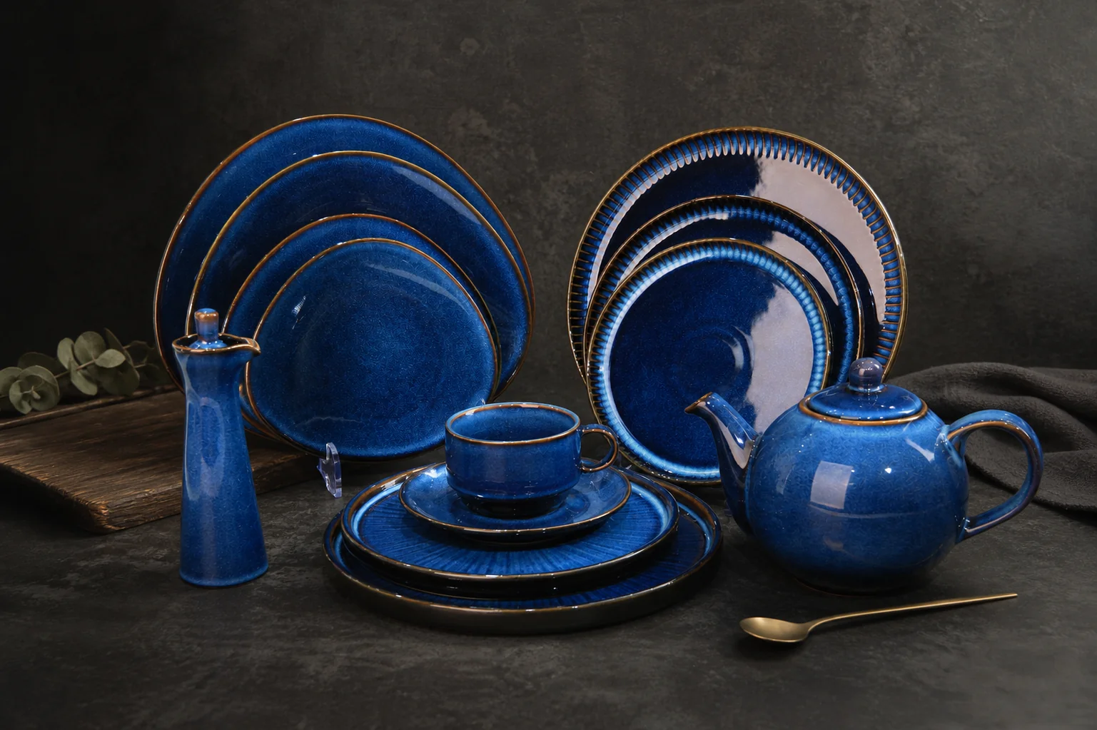 Deep blue tableware with tonal surface variation - styled table scene
