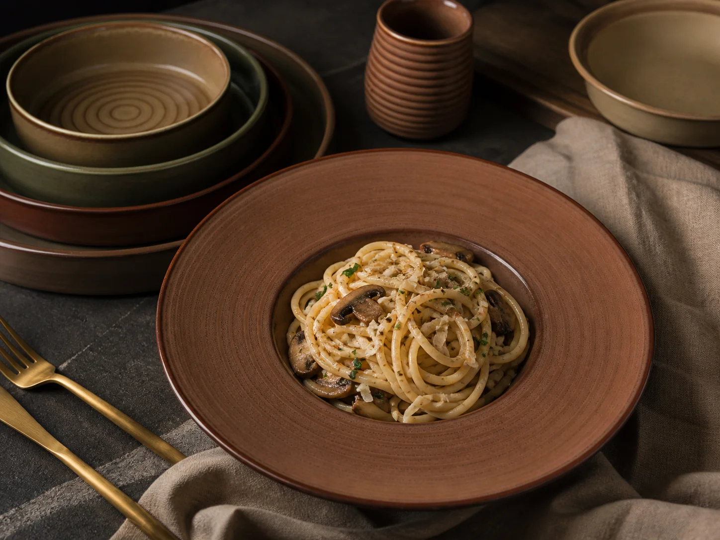 Earth-tone plates in brown and olive colouring - restaurant table application