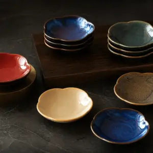 Petal-shaped condiment dishes in mixed colours - styled table scene