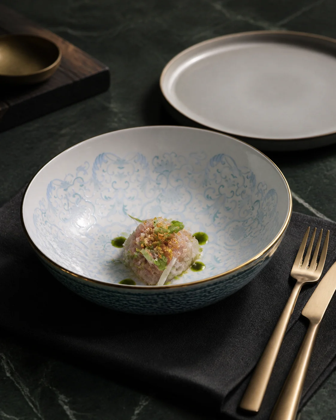 Blue and turquoise display plates with multi-tonal surface effects - restaurant table application