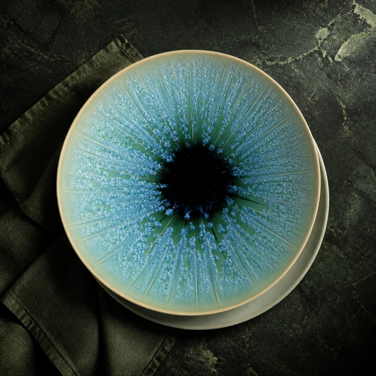 Blue and turquoise display plates with multi-tonal surface effects - full collection overview
