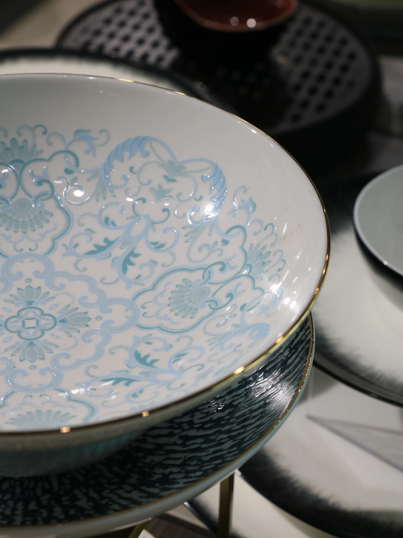 Blue and turquoise display plates with multi-tonal surface effects - product photograph