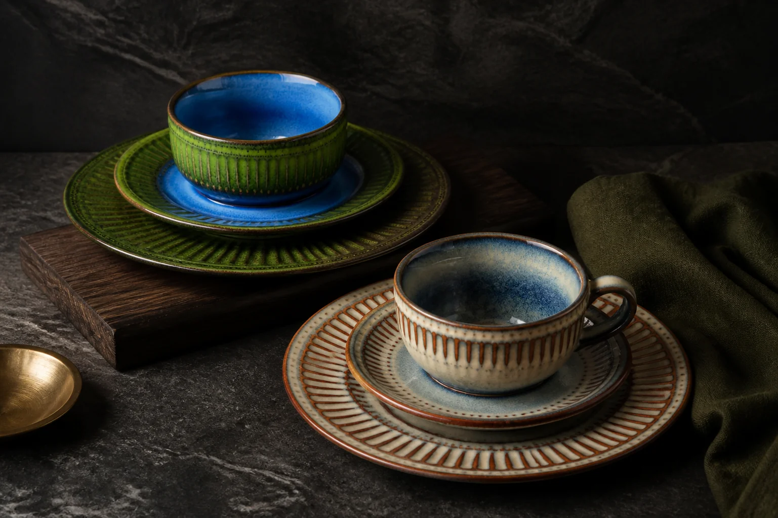 Ribbed cups and saucers in green and blue colouring - styled table scene