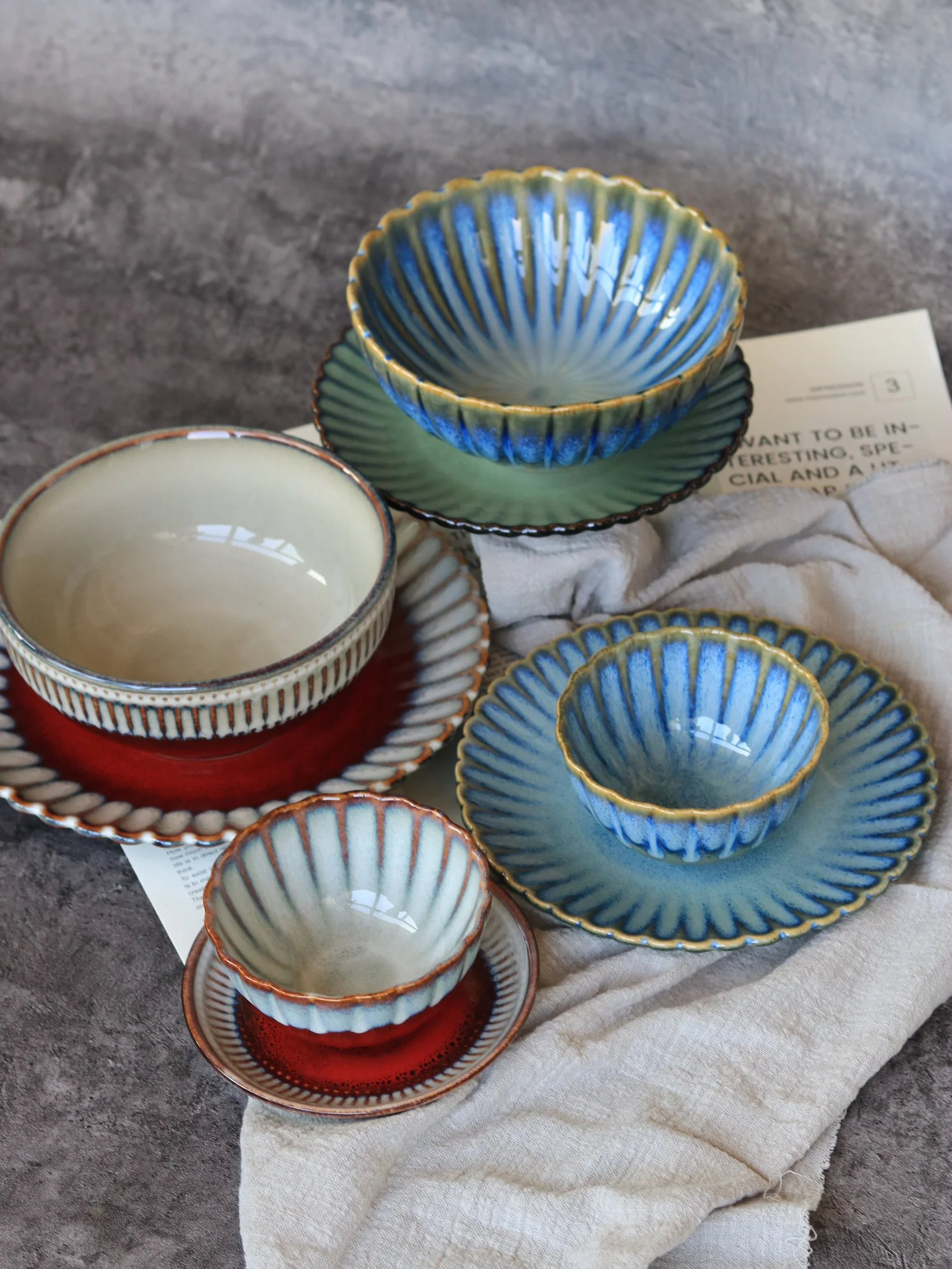 Ribbed cups and saucers in green and blue colouring - product photograph