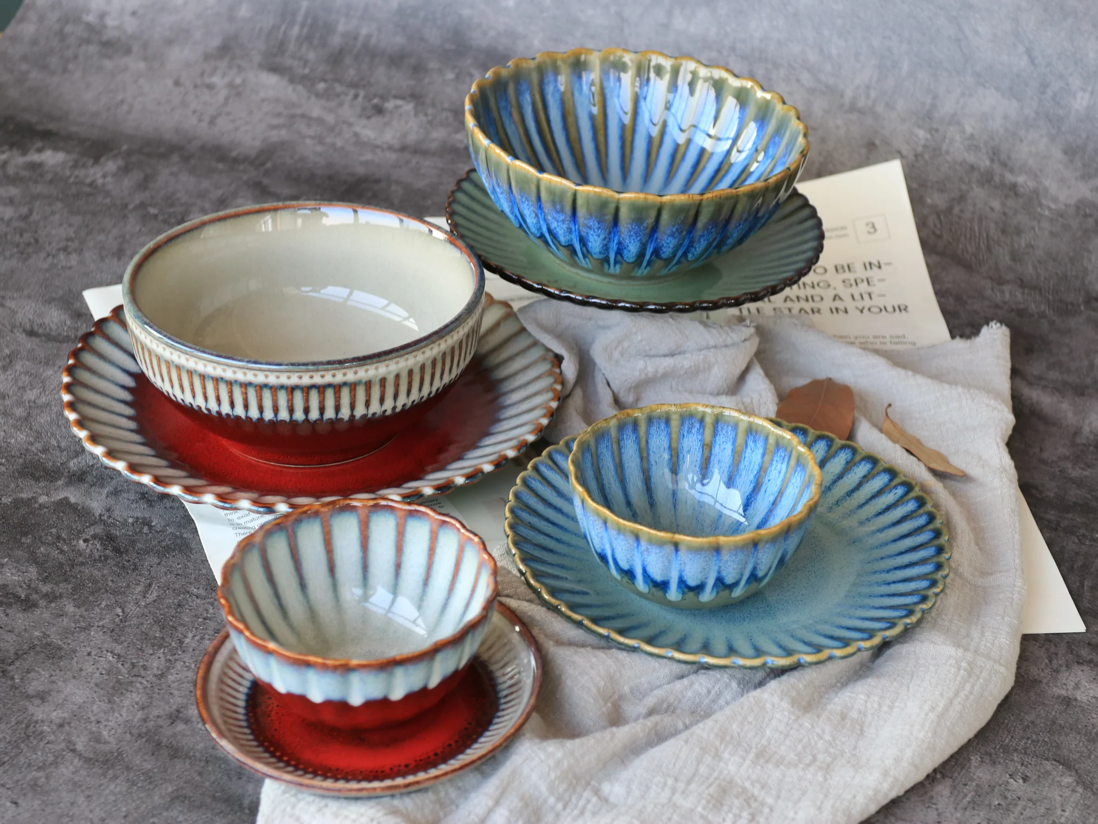 Ribbed cups and saucers in green and blue colouring - product photograph