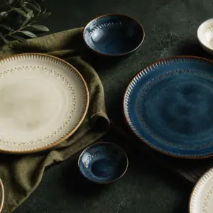 Blue and red patterned tableware with cream plates - styled table scene